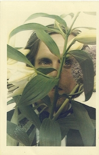 Man behind a plant